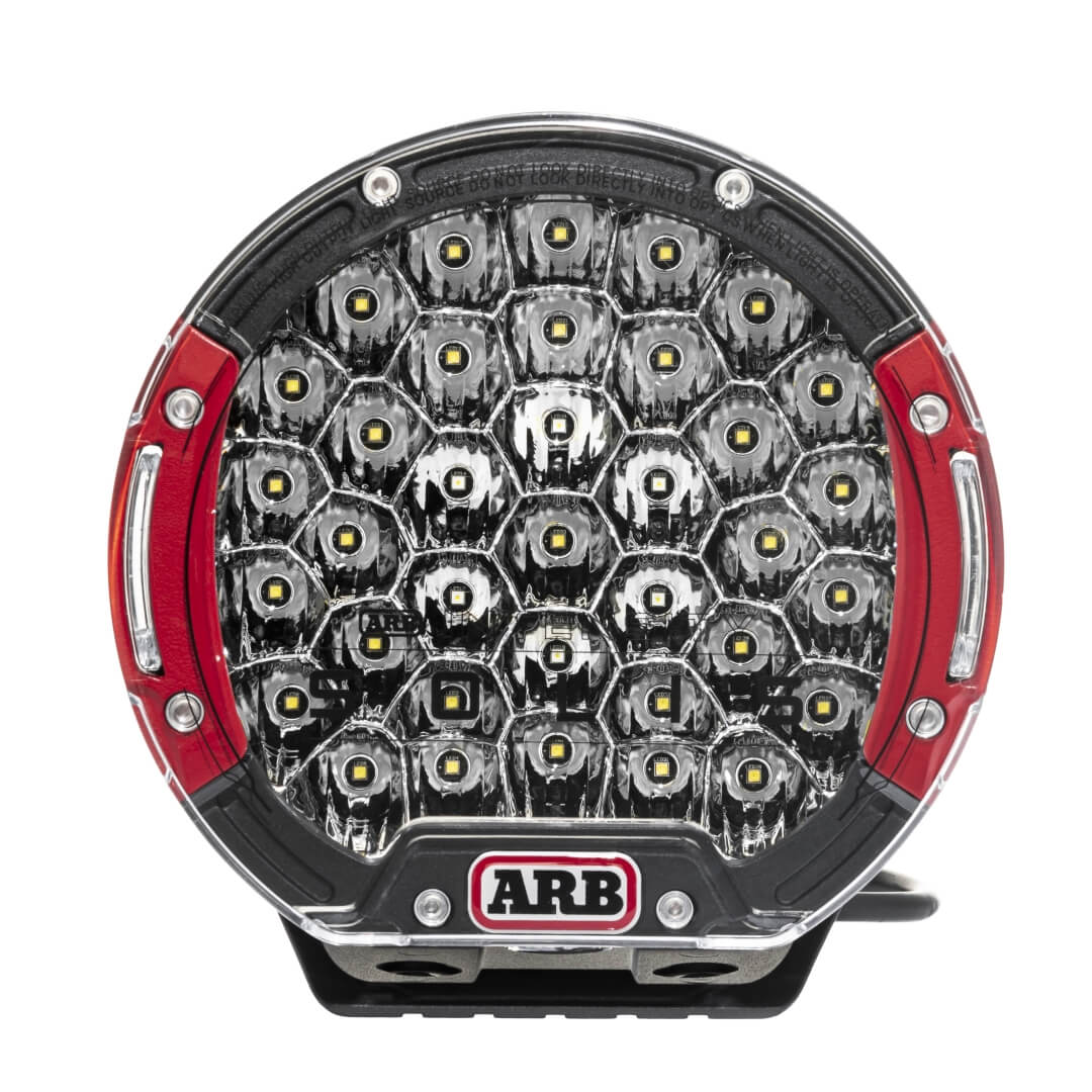 ARB Solis 36 Flood Driving light showing red bezels in a front on image